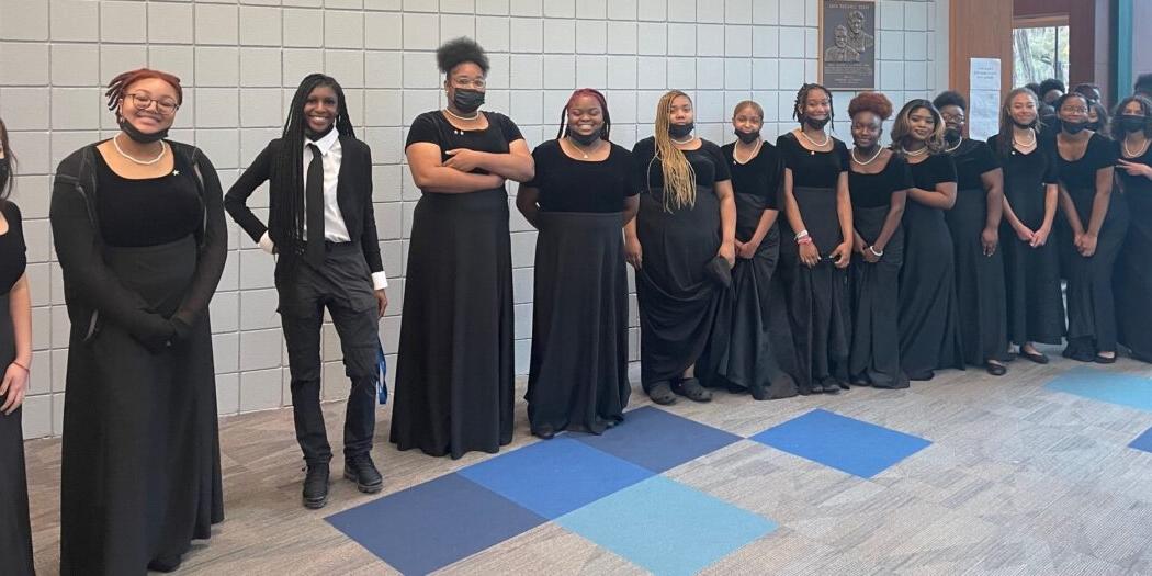 Student choral singers standing in a line